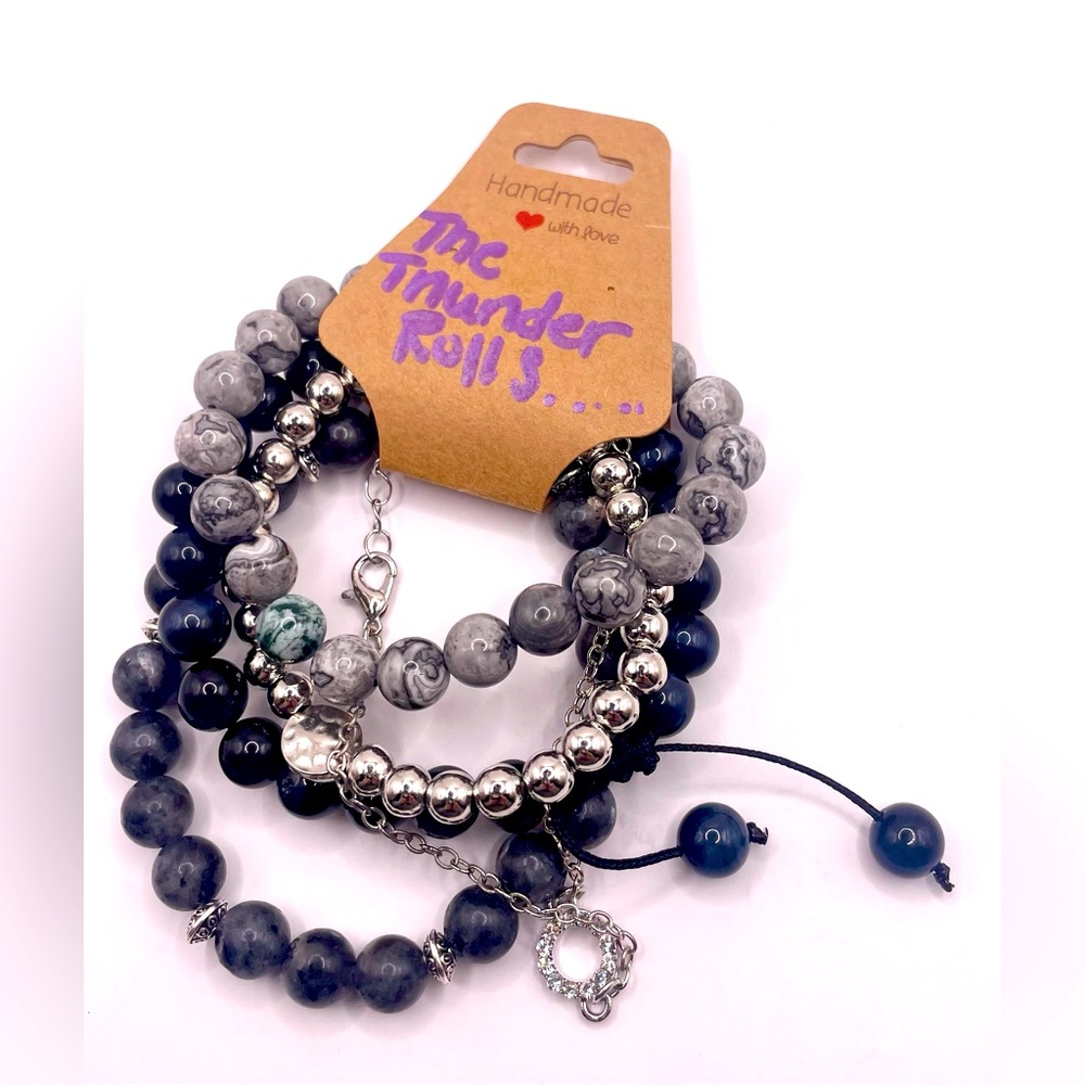 Stackable set of 3 beaded bracelets with 2 silver bracelets. Stretchy adjustable